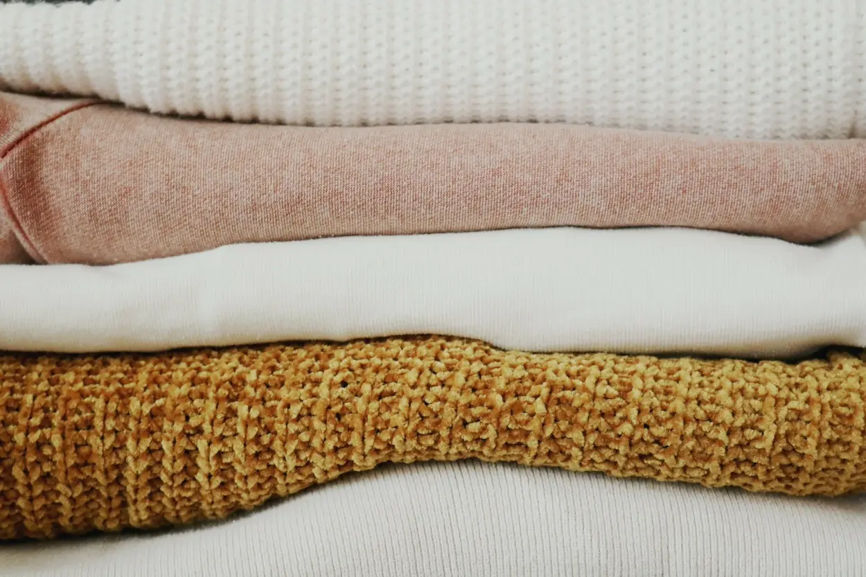 stack of folded sweaters