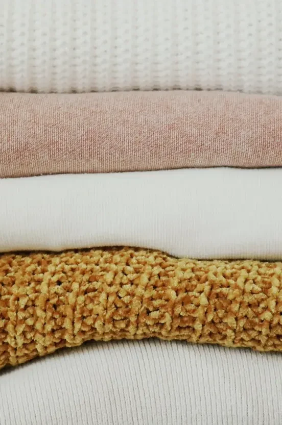stack of folded sweaters