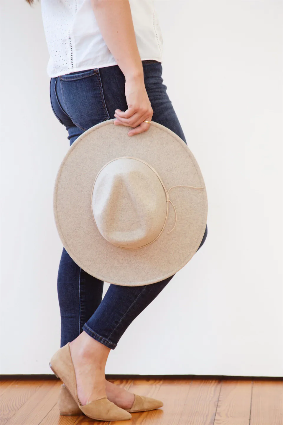 lady holding a hat