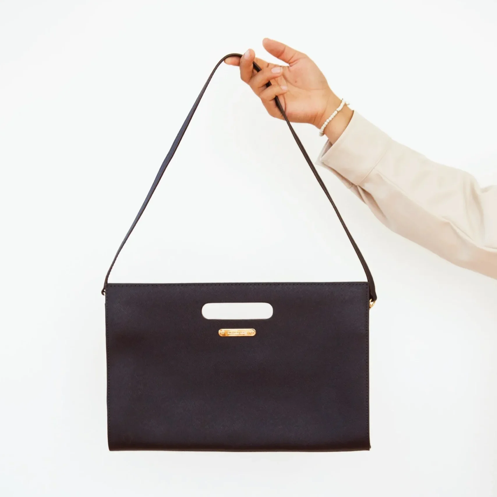 hand holding a purse