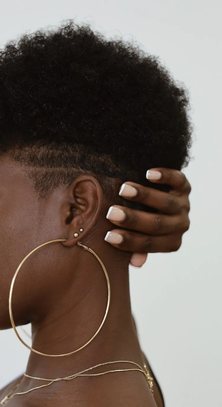 lady with large hoop earrings